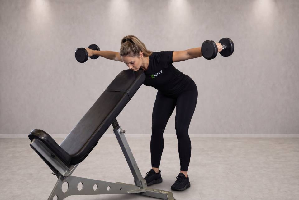 Bent Over Dumbbell Rear Delt Raise With Head On Bench